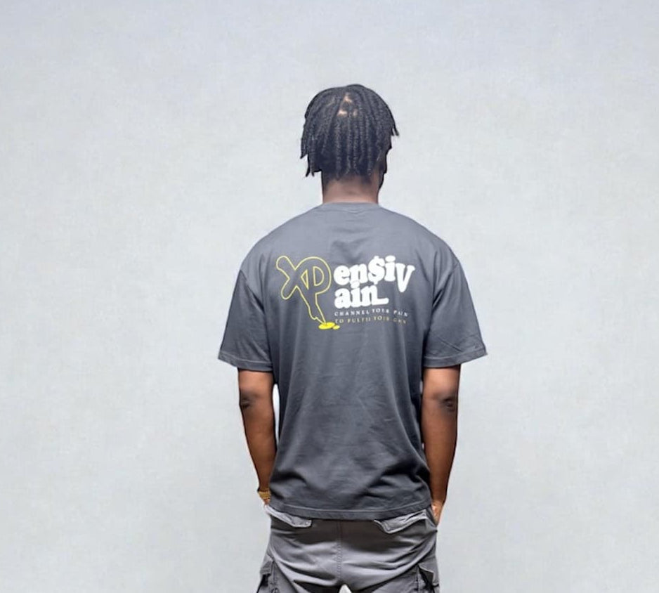Back view of model wearing grey XP London T-shirt with XPensiv Pain graphic print.